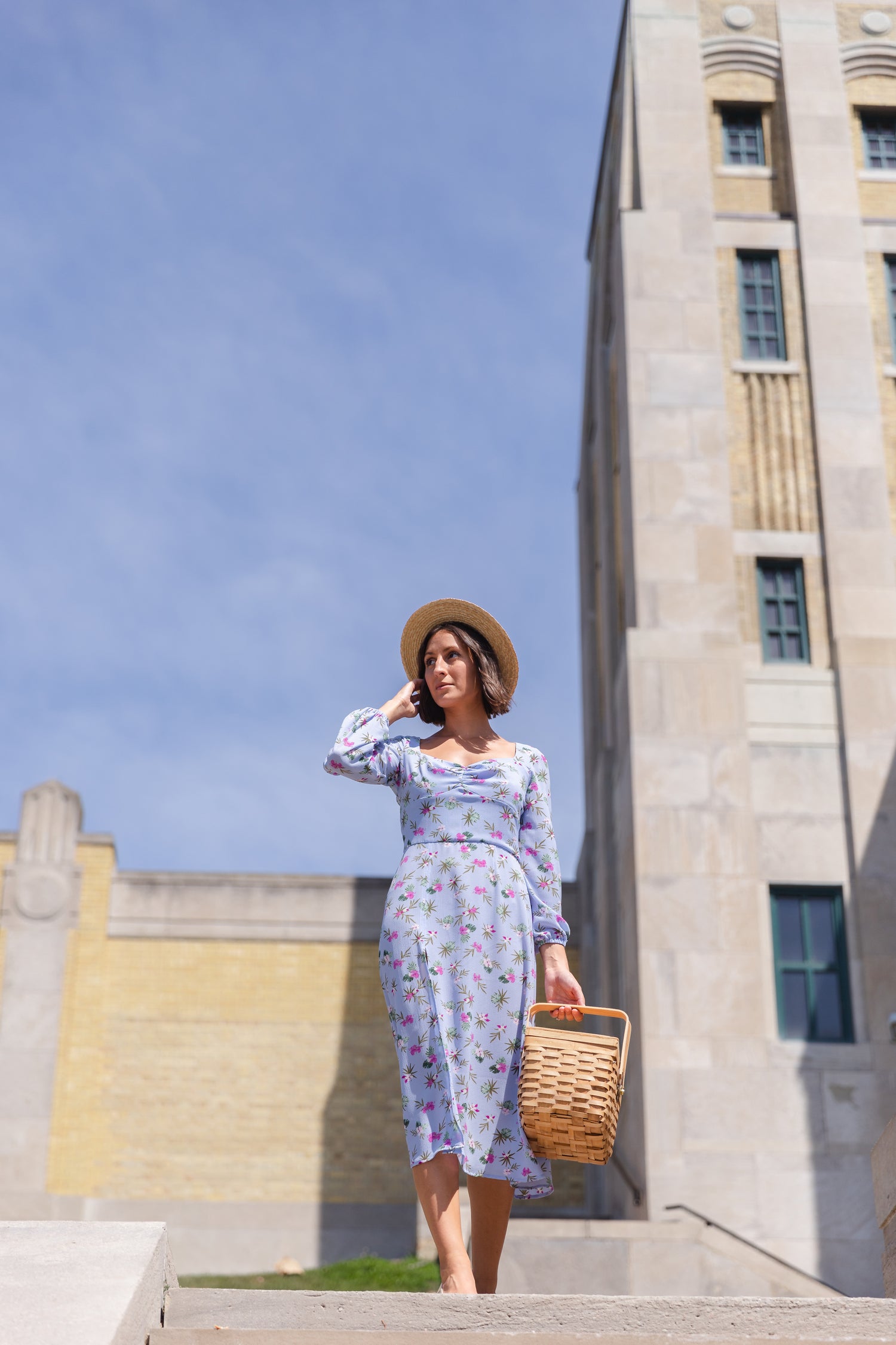 Eloise Dress - a blue floral midi dress with flowy a line skirt and slit, gathered sweetheart neckline, and long billowy sleeves with elastic casing. Designed and made in Canada by ethical and conscious fashion line