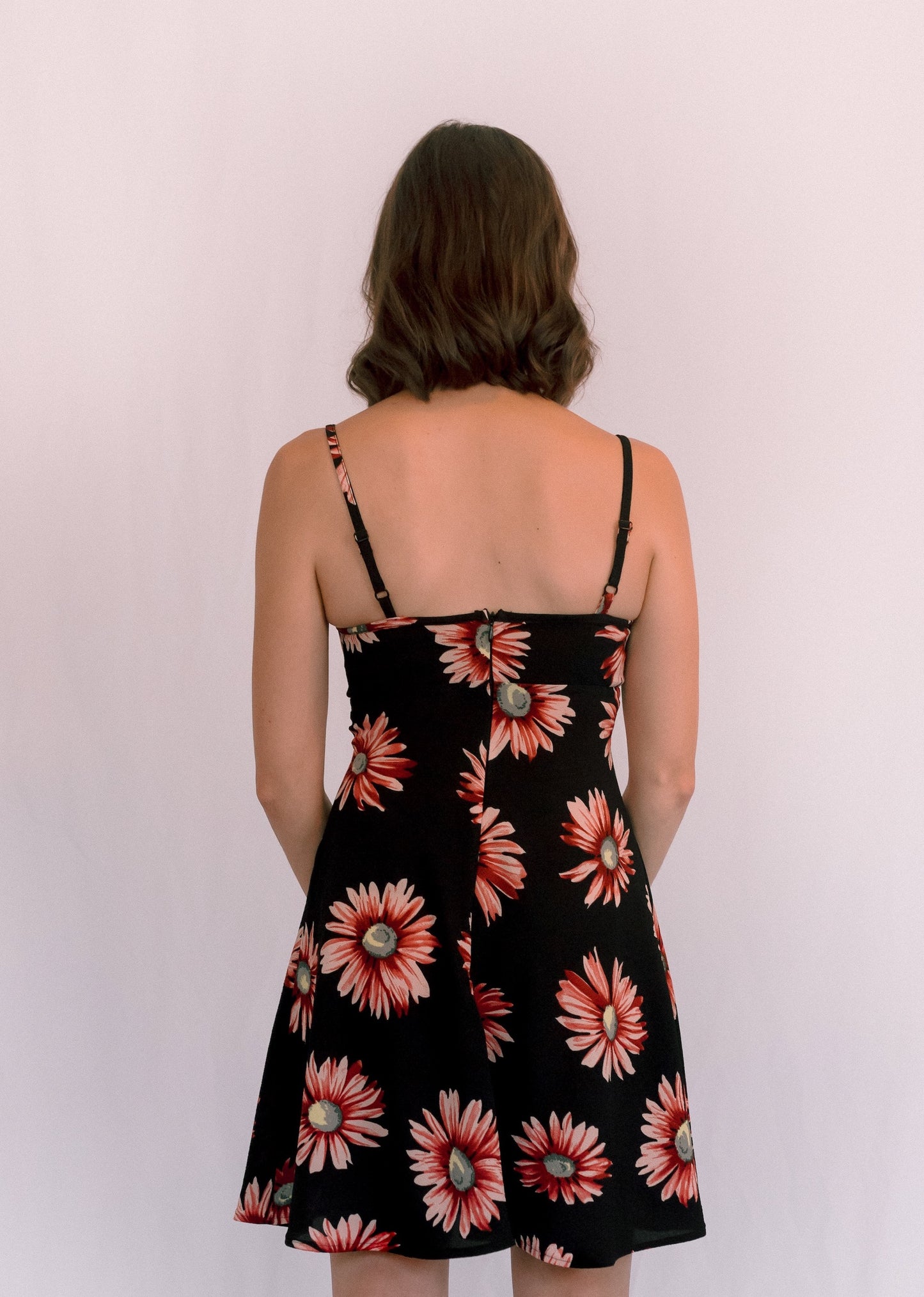 Ethical and sustainable clothing made in Canada - Pros and Cons Apparel. Black floral mini dress, gathered neckline, flowy slip skirt, pink summer dress, adjustable straps