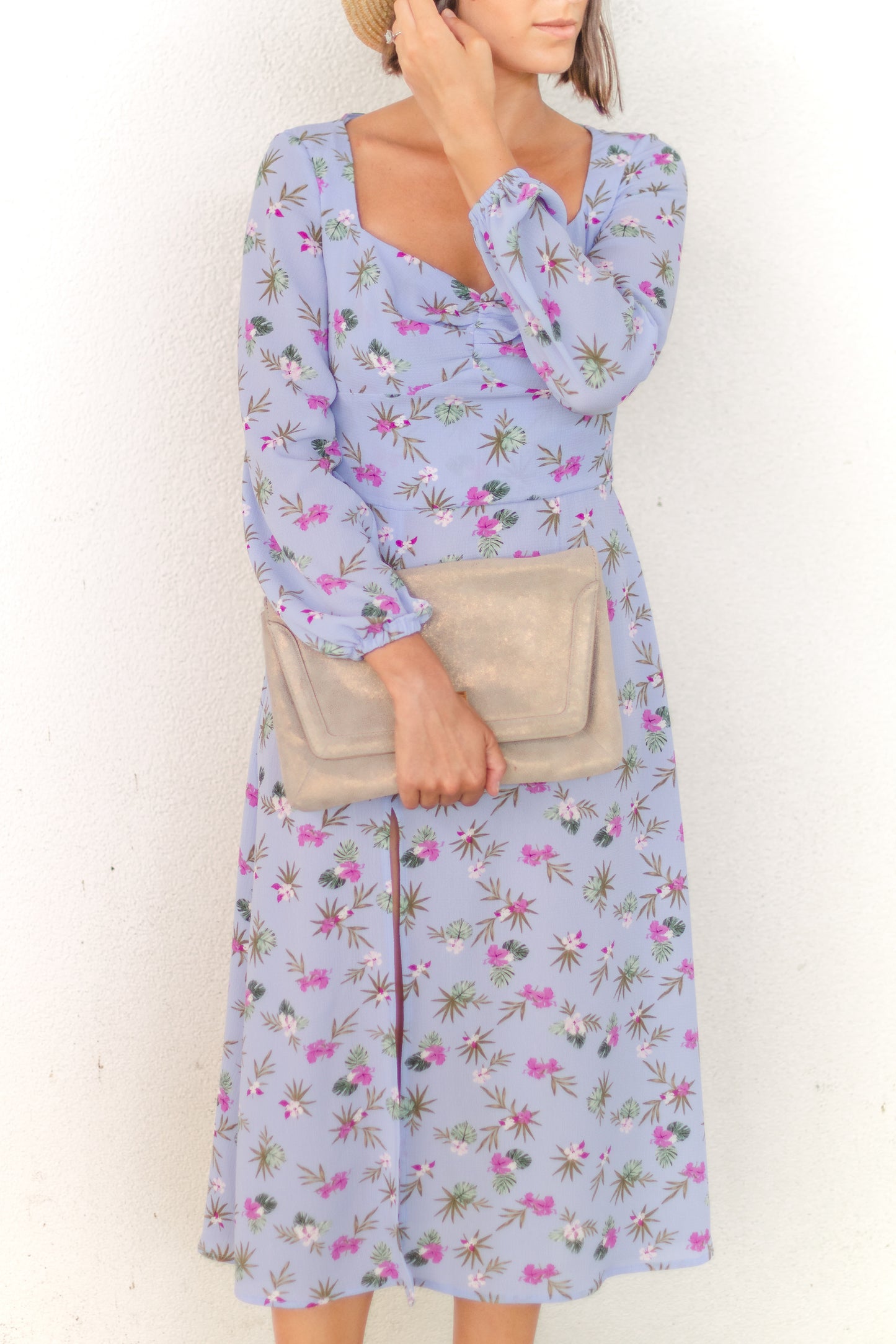 Ethical and sustainable clothing made in Canada - Pros and Cons Apparel. Eloise Dress- Blue floral A line dress. Medium length with long billowy sleeves and elastic sleeve opening. Midi skirt has loose flowing shape and high slit. Bodice includes gathered front and sweetheart neckline.