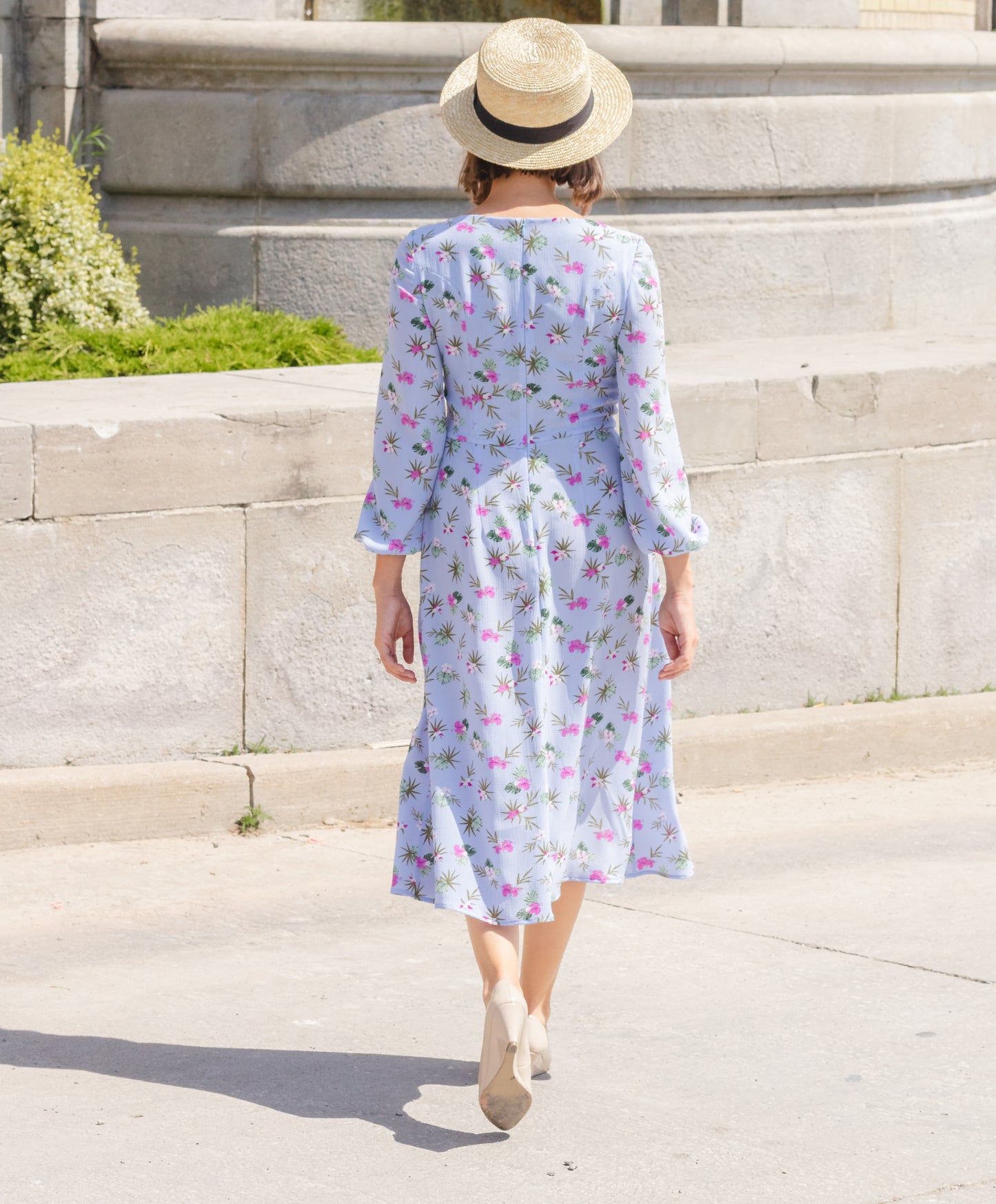 Ethical and sustainable clothing made in Canada - Pros and Cons Apparel. Eloise Dress- Blue floral A line dress. Medium length with long billowy sleeves and elastic sleeve opening. Midi skirt has loose flowing shape and high slit. Bodice includes gathered front and sweetheart neckline.