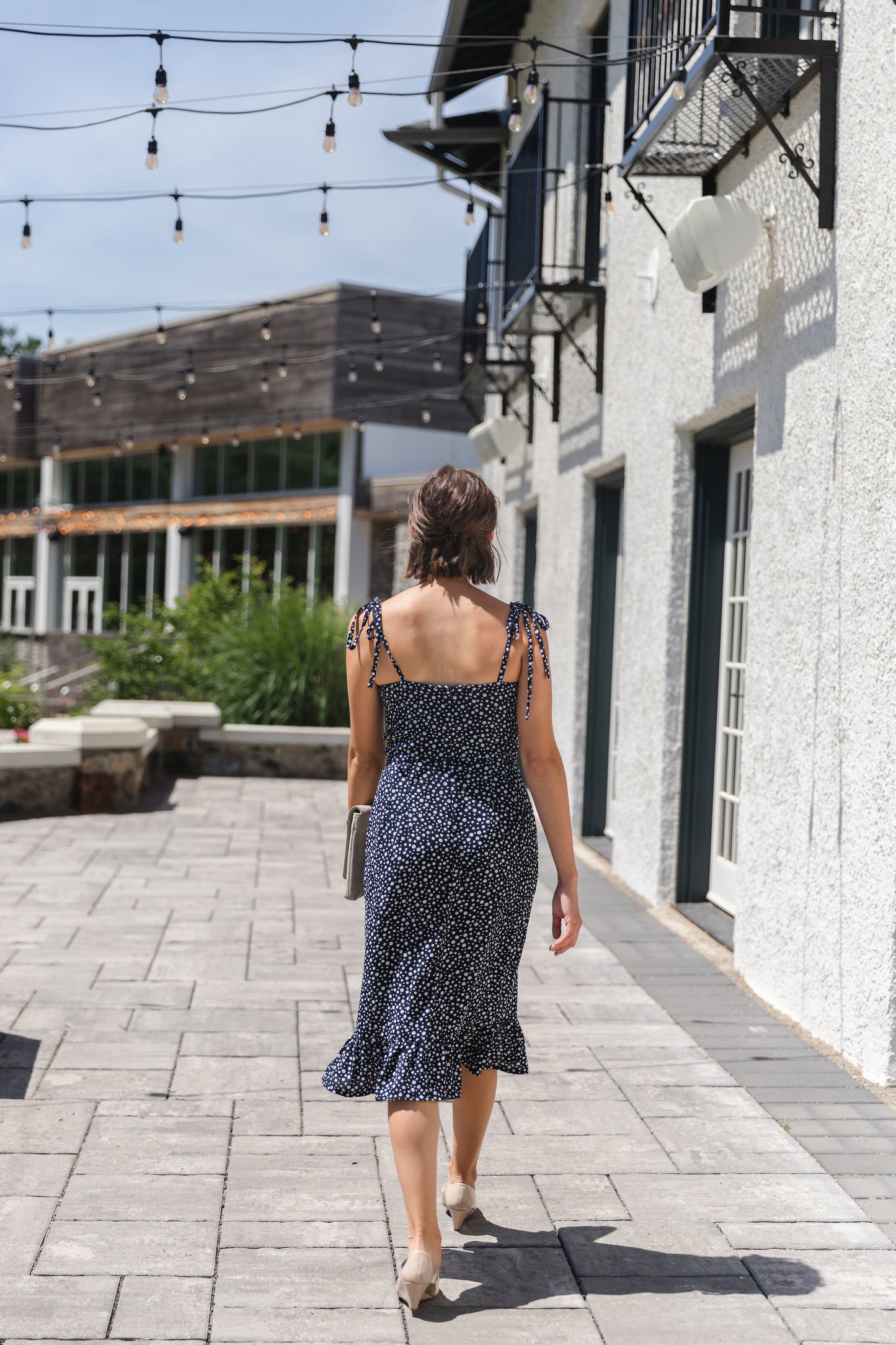 Ethical and sustainable clothing made in Canada - Pros and Cons Apparel.  Blue polka dot tie up dress - Flowy frill sundress with slit