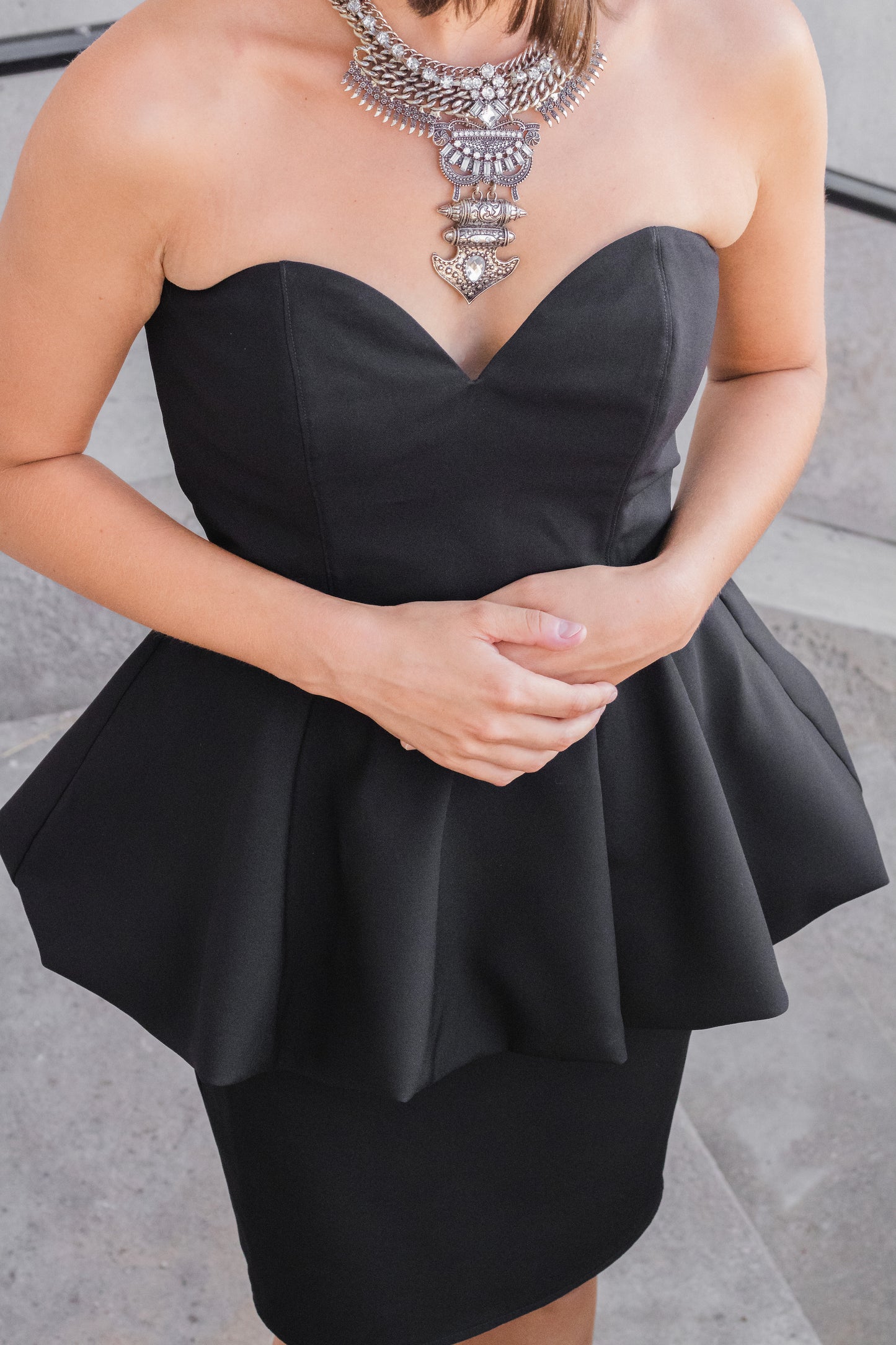 Ethical and sustainable clothing made in Canada - Pros and Cons Apparel.  Strapless little black dress - sweetheart neckline sleeveless mini dress - peplum skirt LBD